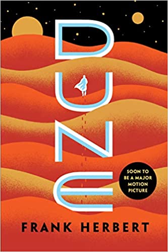 Book cover of Dune: the silhouette of a man walking across a series of desert dunes